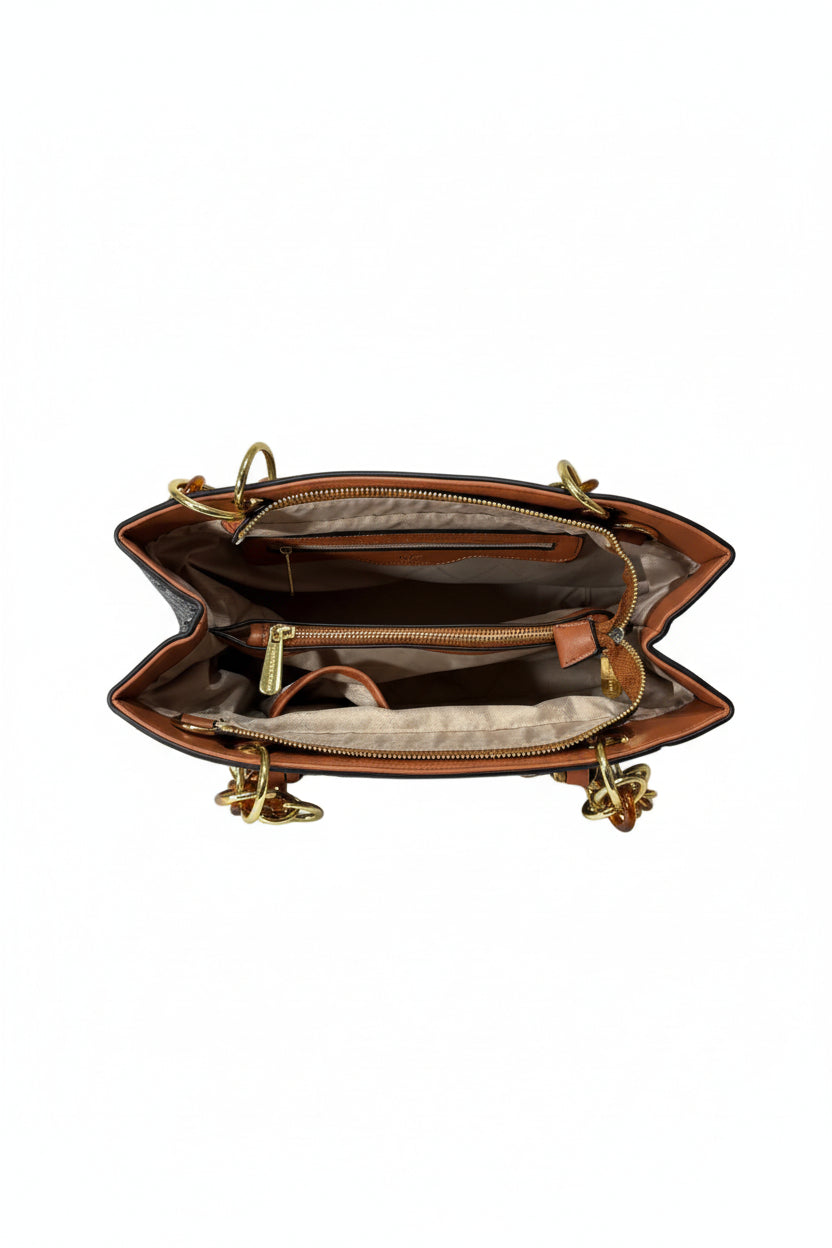 Brown leather handbag with gold zippers on a white background